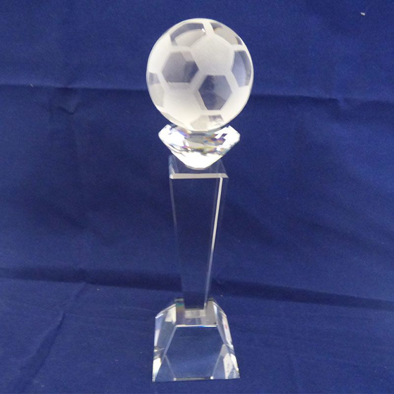 Picture of Glass football on a tall pedestal. 245mm